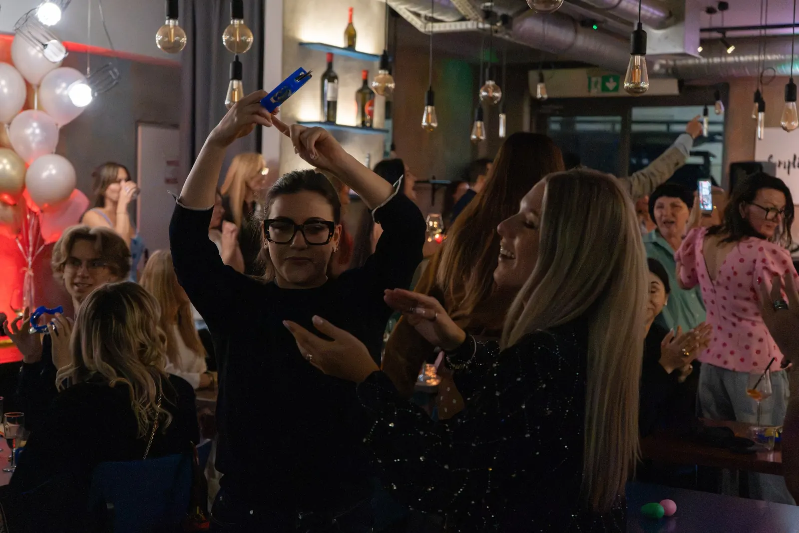 Guests dancing among balloons at a party at Bottegas, ul. Oboźna 9, Warsaw